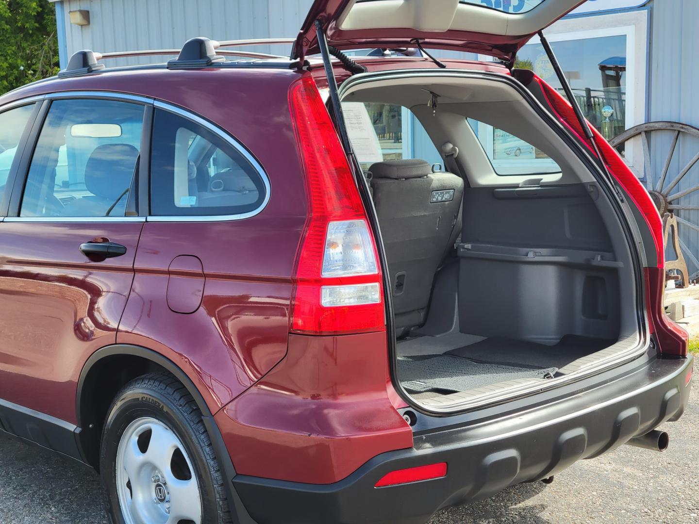 2009 Red /Gray Honda CR-V LX (5J6RE483X9L) with an 2.4L L4 engine, 5 Speed Automatic transmission, located at 450 N Russell, Missoula, MT, 59801, (406) 543-6600, 46.874496, -114.017433 - Great Running AWD SUV. 2.4L I4 Engine. 5 Speed Automatic Transmission. Air. Cruise. Tilt. Power Windows and Locks. New Tires. Roof Rack. Does have a Rebuilt Title so financing is not available. - Photo#9